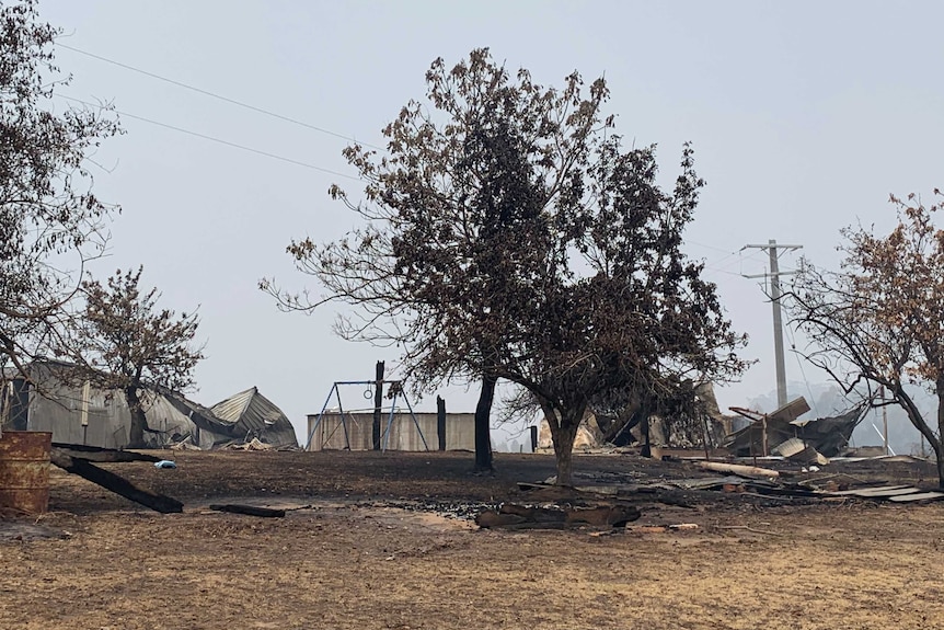 Corrugated iron and bricks of house flattened by bushfire