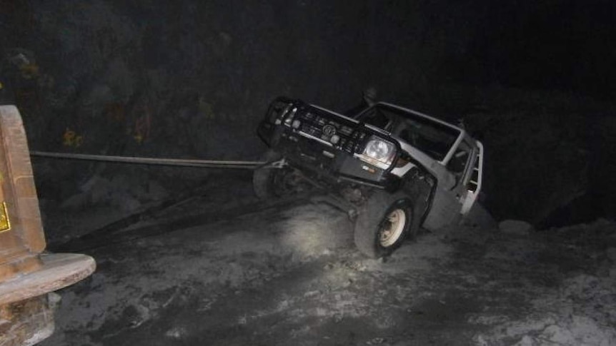 A Toyota Landcruiser sits on the edge of a 20m-deep hole at an underground mine near Kambalda.