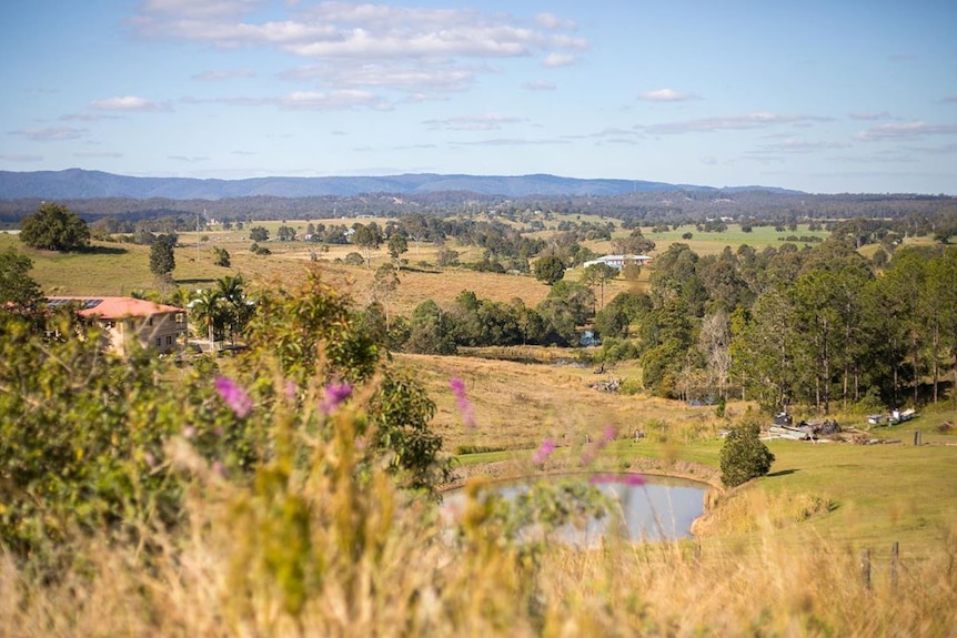 Farm houses and properties with hills in the background near Gympie in Queensland