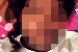 A heavily pixellated man