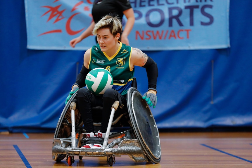 Robyn Lambird in action playing wheelchair rugby.