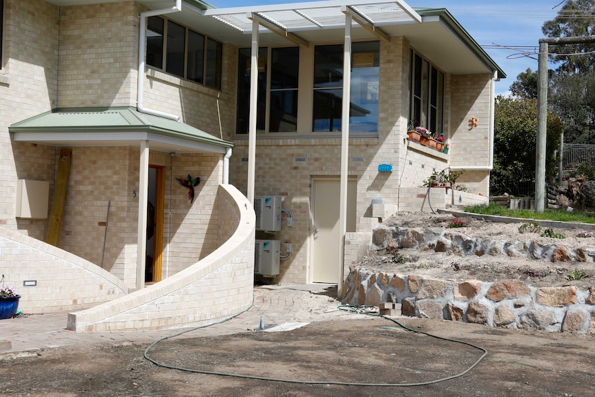 John and Trish Hagan's new house, which they built using the same plans as their old house after it was destroyed in the Mr Fluffy buyback.