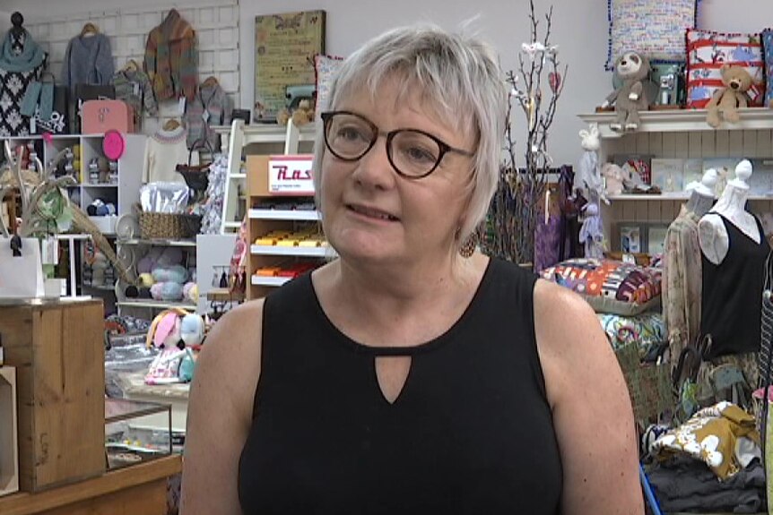 Chris Richardson stands in her shop.