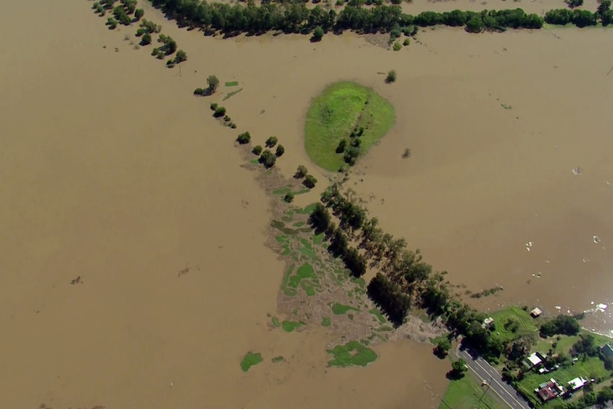 Floodwater inundates a paddock in Sydney's north-west