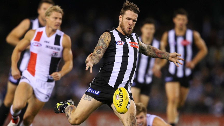 On the press ... Dane Swan launches a kick on goal