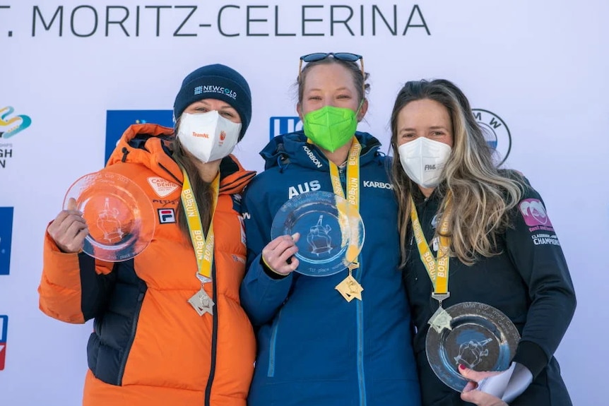 Jackie Narracott with her gold medal and trophy after winning the World Cup Skeleton event