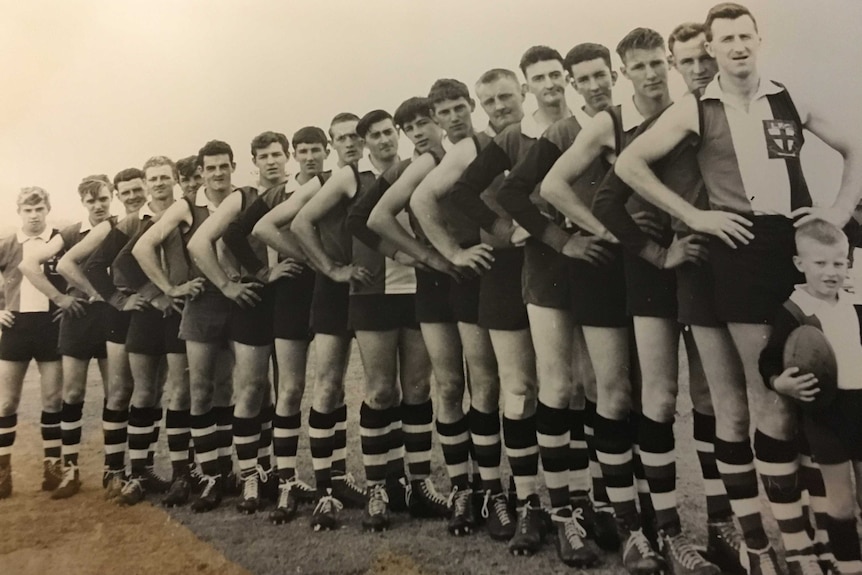 Members of the inaugural 1967 Channel Saints team, with team mascot Richie McGuinness in front.