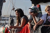 Seven female pro-Palestine activists talk while on board a boat bound for Gaza.