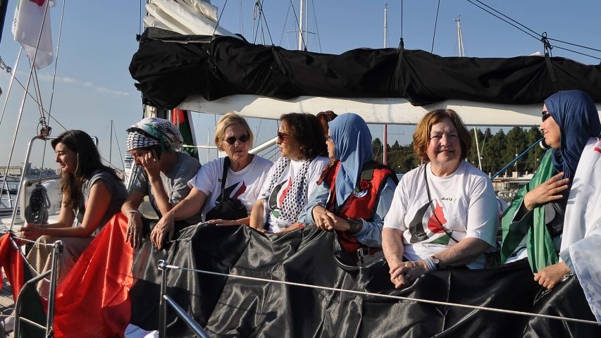 Seven female pro-Palestine activists talk while on board a boat bound for Gaza.