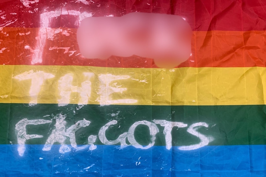 A vandalised rainbow flag.