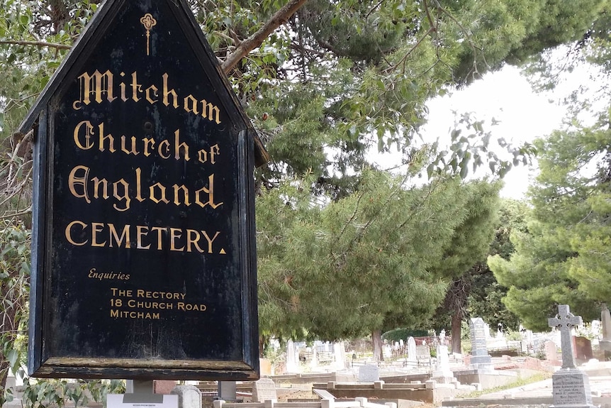 Mitcham Church of England Cemetery sign and graves.
