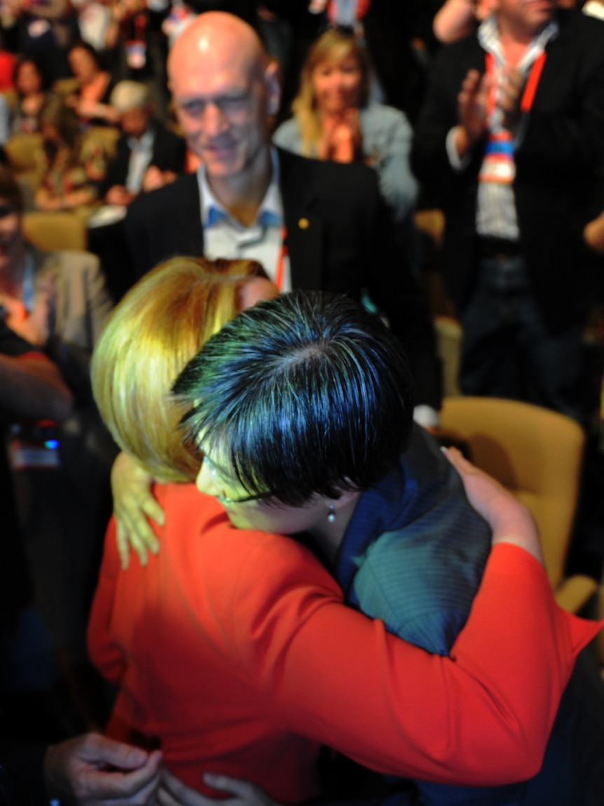 Prime Minister Julia Gillard hugs Senator Penny Wong
