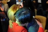 Prime Minister Julia Gillard hugs Senator Penny Wong