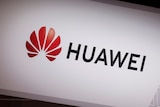The red logo of Huawei Technologies is seen at an exhibition space.