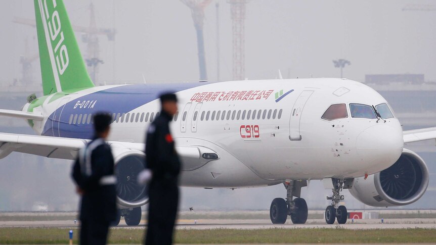 A Chinese C919 passenger jet sits on a runway in Shanghai.