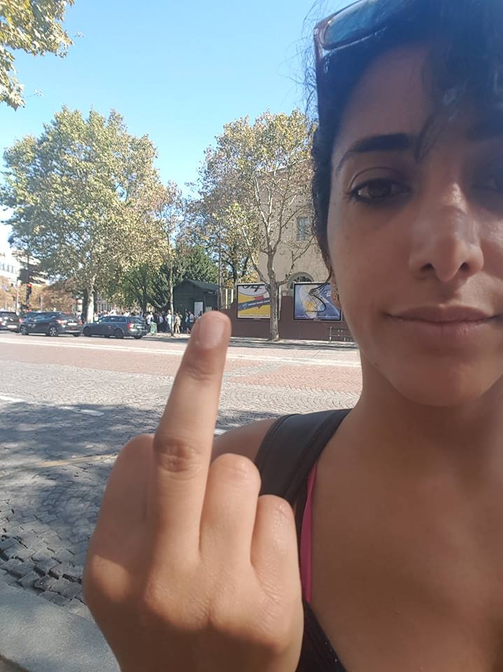 Selfie photf of Roya Hosini sticking her middle finger up to the catacombs