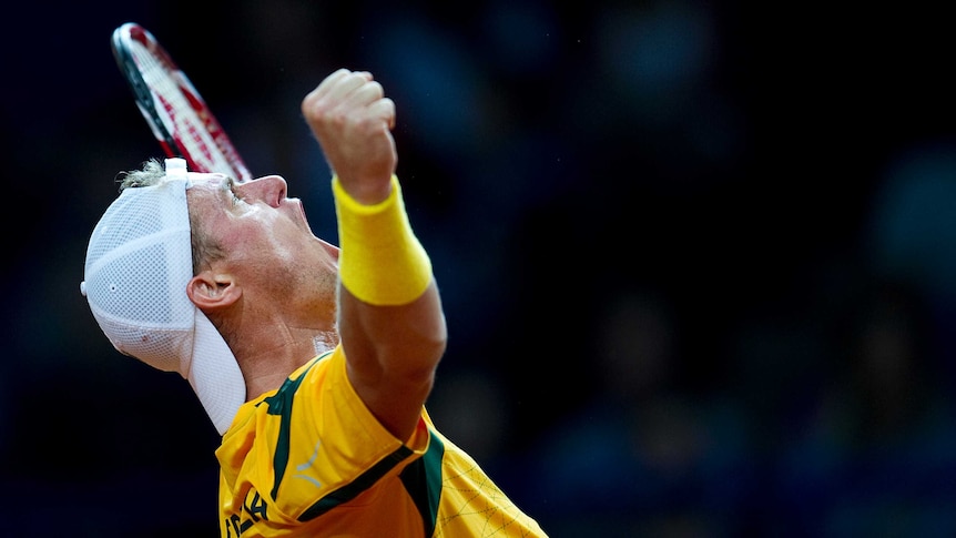 Australia's Lleyton Hewitt celebrates victory over Poland's Lukasz Kubot in their Davis Cup match.