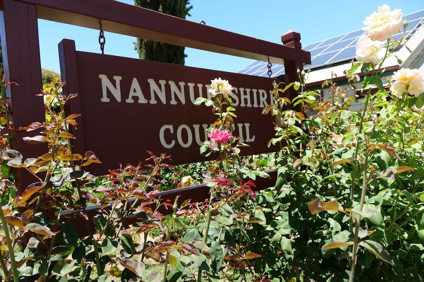 Roses in front of a sign for the Nannup Shire Council