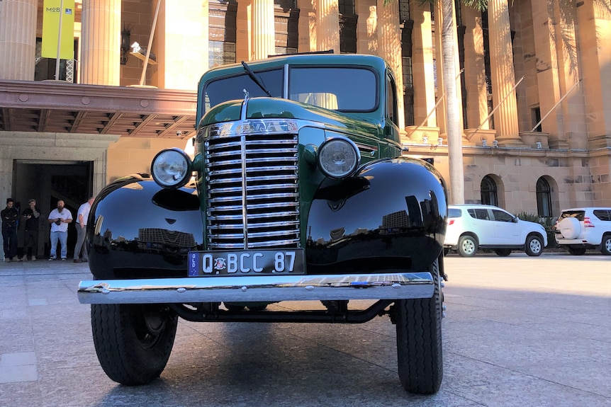 A restored Chevy truck in front of Brisbane City Hall