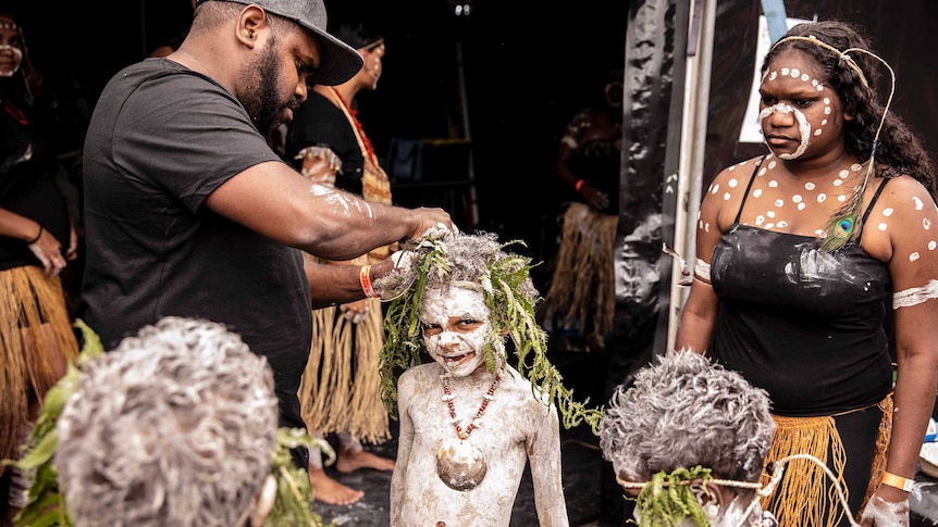 Colour photo of father Shaka Bero and son Wutana of ALLUKMO Dancers getting ready backstage at Dance Rites 2018.