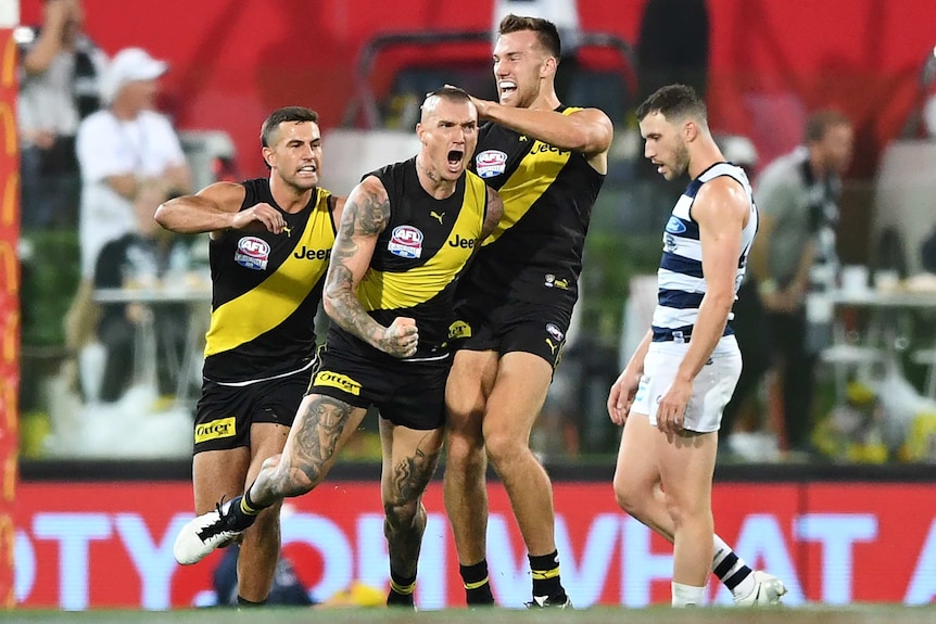 Dustin Martin roars with delight after scoring against Geelong in the AFL grand final at the Gabba