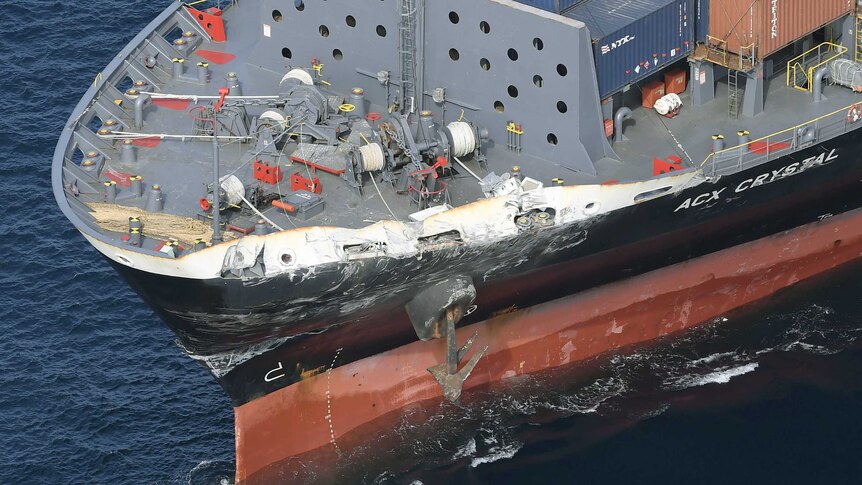 An aerial view of the dented and scraped front port side of the container ship ACX Crystal.