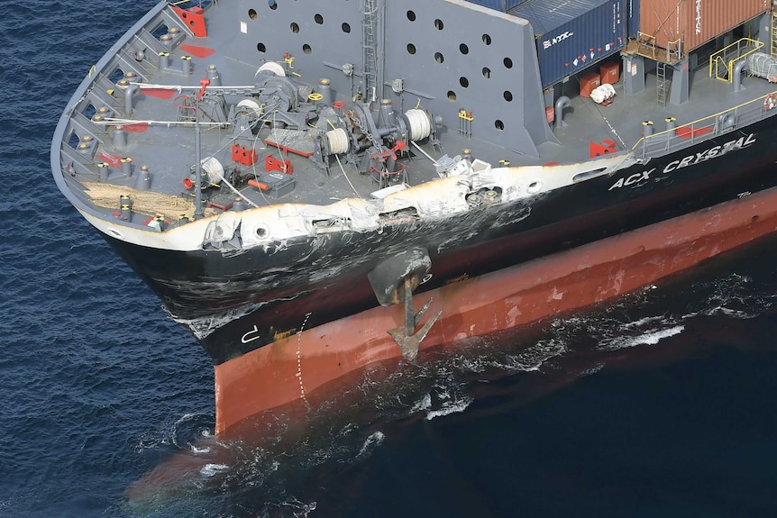 An aerial view of the dented and scraped front port side of the container ship ACX Crystal.