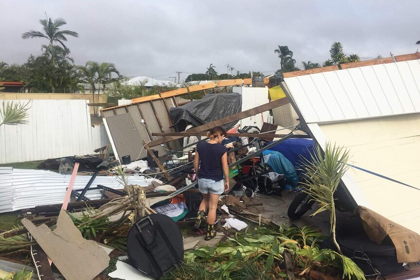 Resident looks at damage at a property in Bundaberg in Queensland after storm on October 3, 2017.