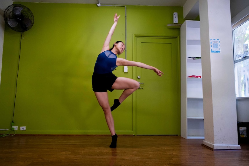 17-year-old Grace Huynh doing a dance in a studio