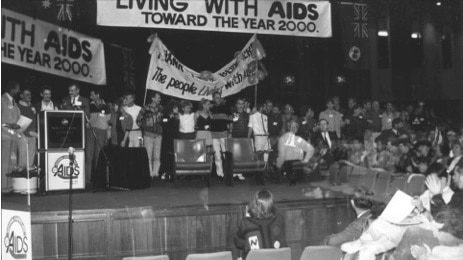 Attendees take to the stage at the 1988 National Conference on HIV/AIDS in Hobart.