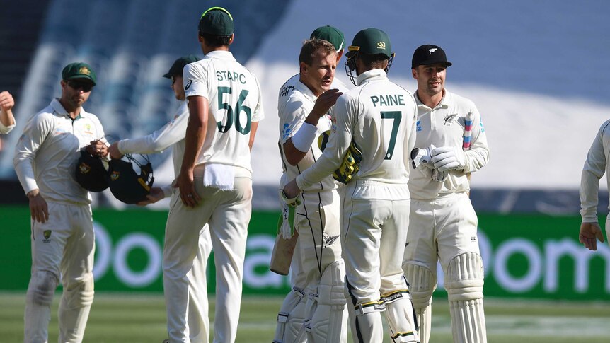 Players shake hands after the completion of the Boxing Day Test at the MCG.