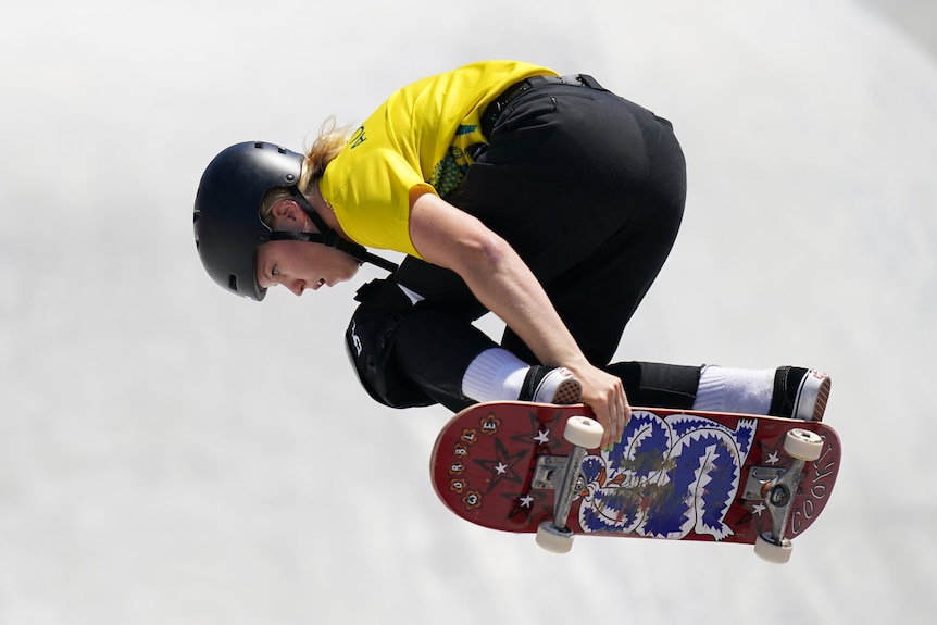 Poppy Olsen gets some air on her skateboard.