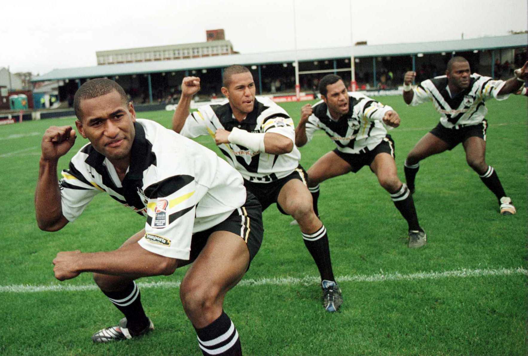 A group of players do a war dance before a rugby league match