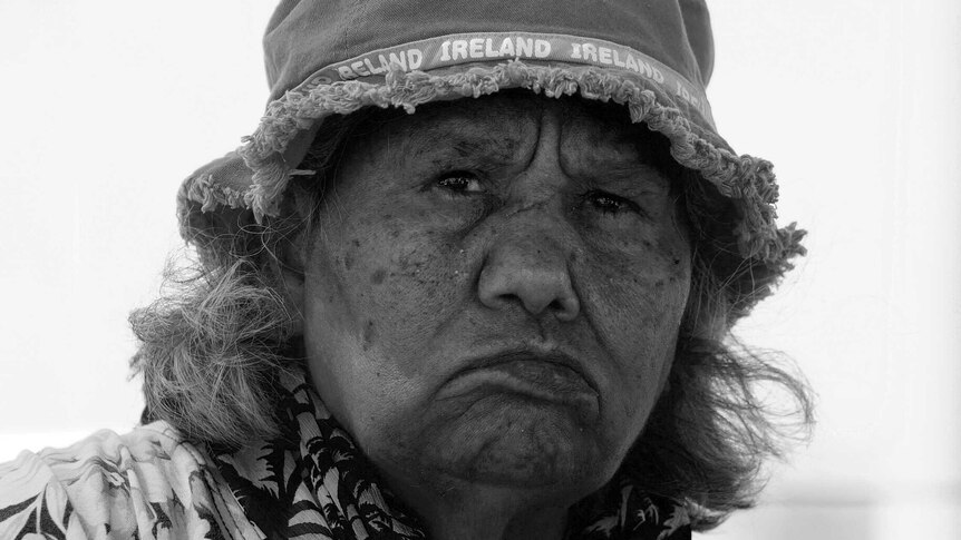 A black and white portrait of Ngarluma elder Pansy Hicks wearing a hat.