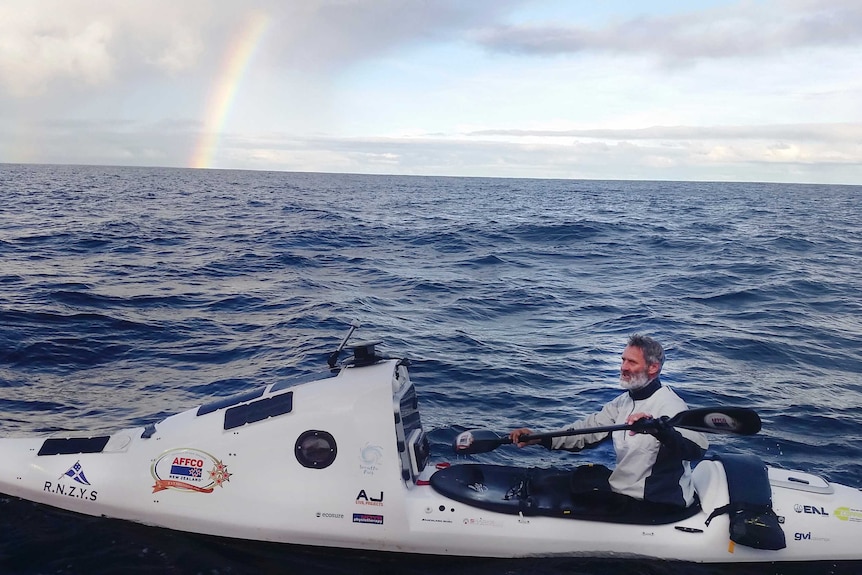 Scott Donaldson paddles his kayak in the Tasman Sea
