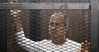 Peter Greste in the defendants cage during his trial in Cairo, June 1 2014