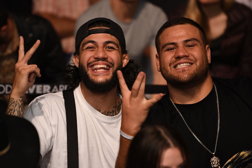 Tyson Pedro and Tai Tuivasa pose with their hands up