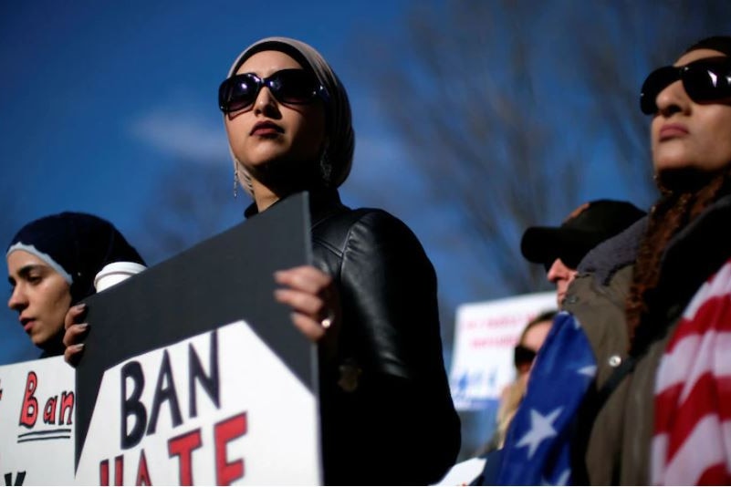 Muslim protesters gather to object to Donald Trump's ban on Muslim-majority countries.