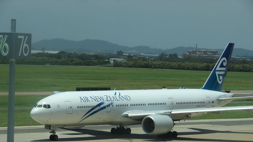 Air New Zealand jet taxi-ing along runway at Brisbane international airport