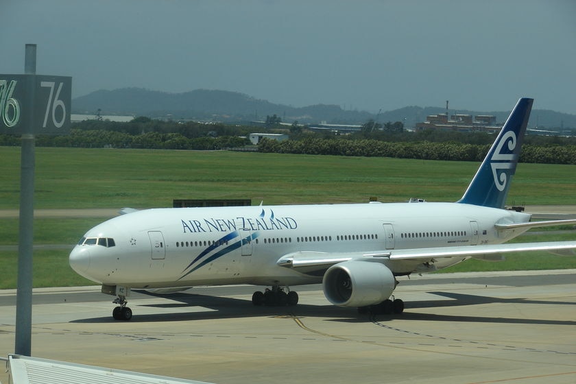 Air New Zealand jet taxi-ing along runway at Brisbane international airport