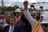 People celebrate the completion of the Florida bridge