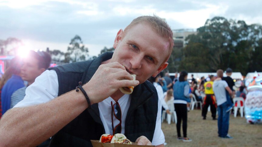 Matt Turnbull eats a bao.