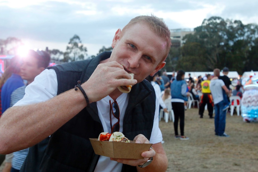 Matt Turnbull eats a bao.