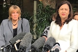 Mary Adams (left) stands behind Queensland Premier Annastacia Palaszczuk speaking to the media at Parliament House in Brisbane.