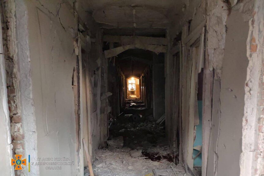 A damaged corridor in a shelled building.