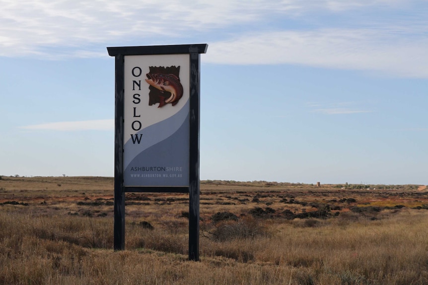 A roadside sign featuring an illustration of a fish and the word 'Onslow'.