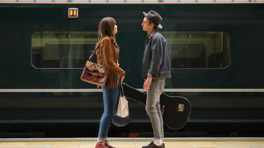 Maggie, left, and Street, right, stand in front of a still train at London's Padding