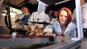 Gillard on a tour of the Centre for Organic Photonics and Electronics at the University of Queensland in Brisbane on July 23,...