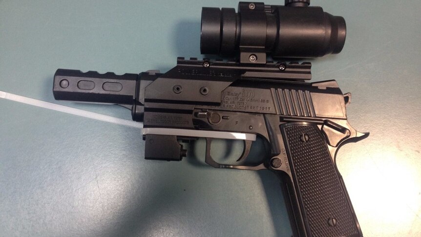 A gun seized in police raids in Gladstone and Tannum Sands in central Qld.