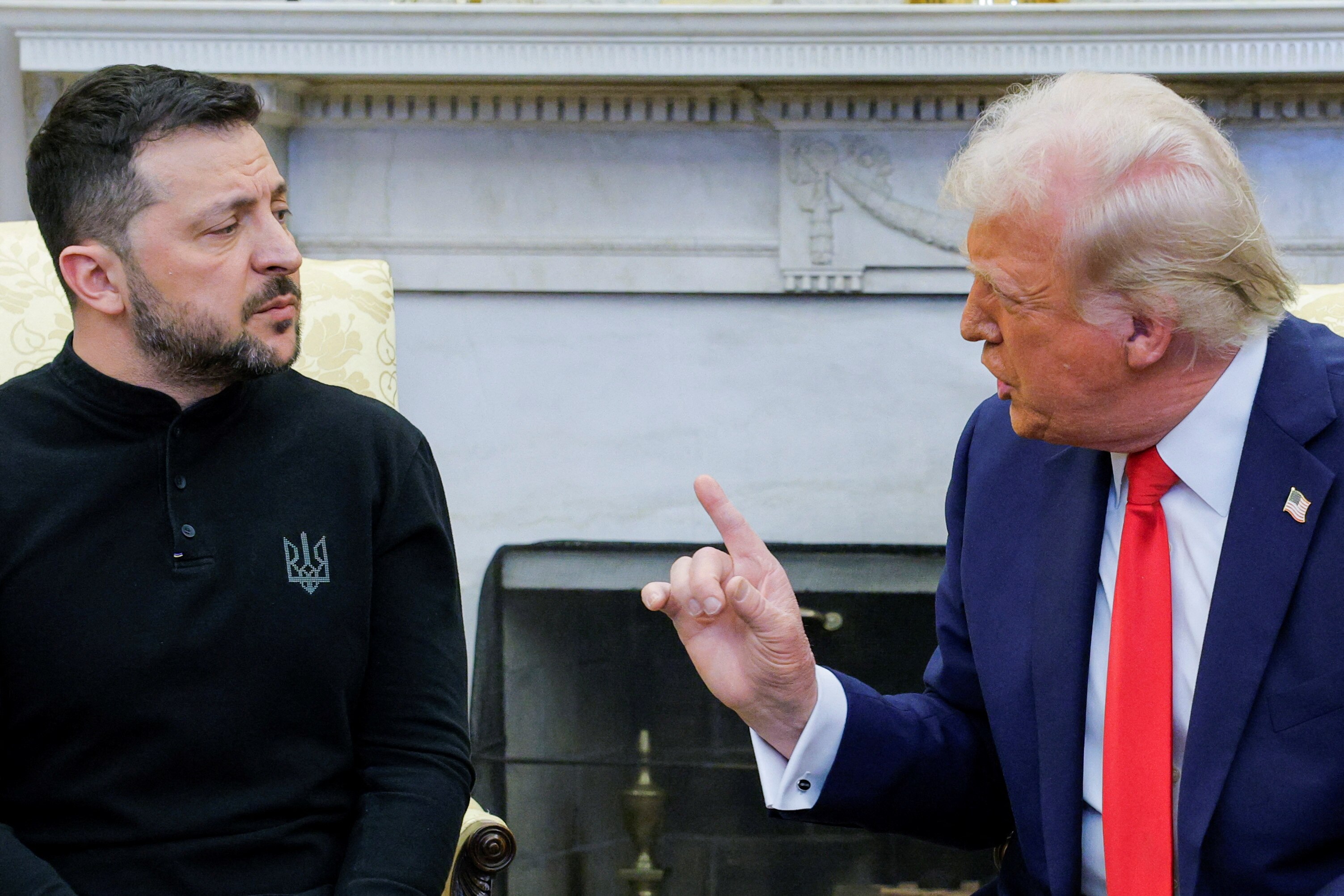 Donald Trump in the Oval Office, speaking and pointing at Volodymyr Zelenskyy.
